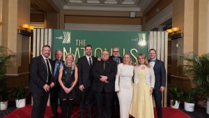 Knauf North America team receiving the NAHB Global Innovation Award for their Certified insulation at The Nationals gala 2025