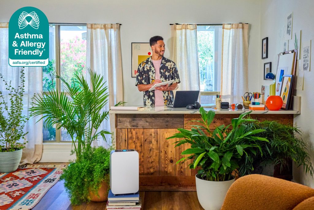 Alen BreatheSmart 25i air purifier, Certified Asthma & Allergy Friendly®, improving indoor air quality in a home office with plants and natural light.