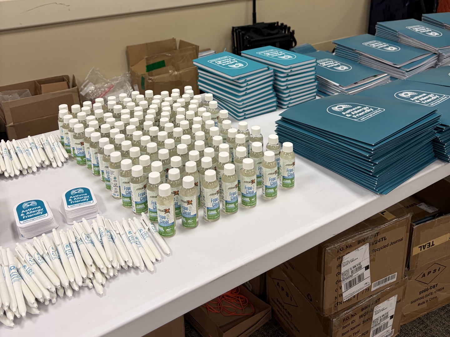 Asthma & Allergy Friendly Certification Program branded materials and Free & Clear Certified laundry detergent samples prepared for inclusion in resource tote bags at the 2026 Chicago Asthma Consortium Community Health Worker Educational Forum.