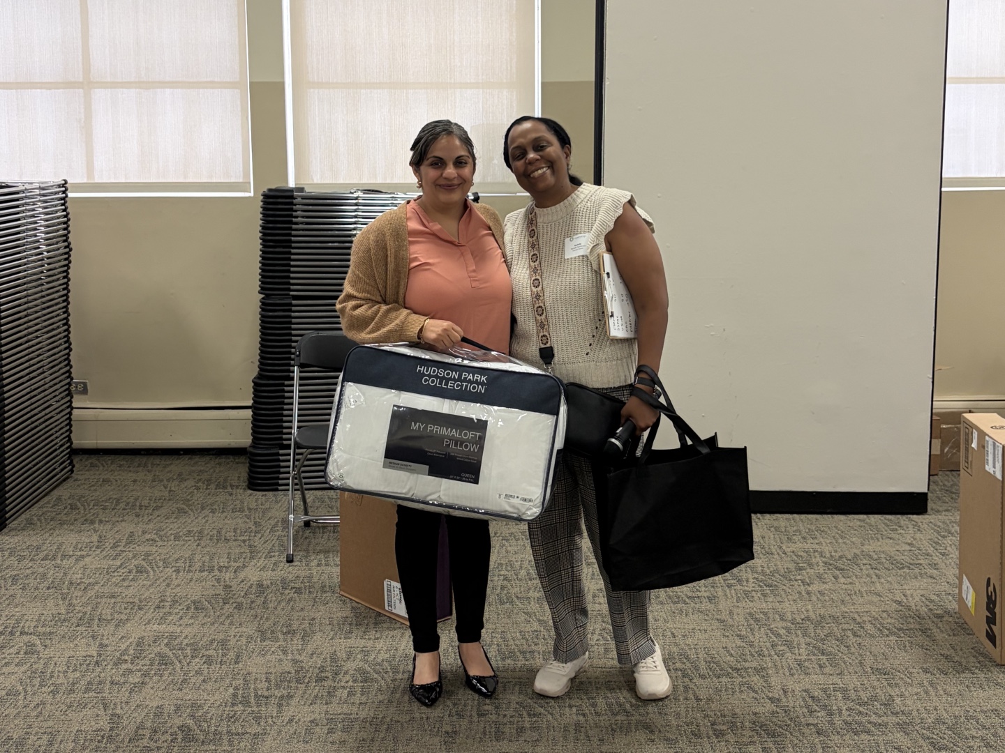 Rachelle Paul-Brutus, Executive Director of the Chicago Asthma Consortium, with Certified partner product donations at the 2026 Community Health Worker Educational Forum.